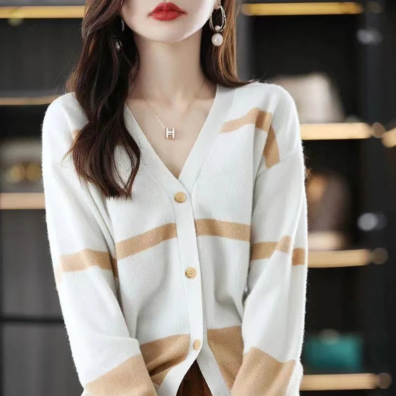 Women's slim fit V-neck cardigan with a raised 3D striped knit pattern in black and white.