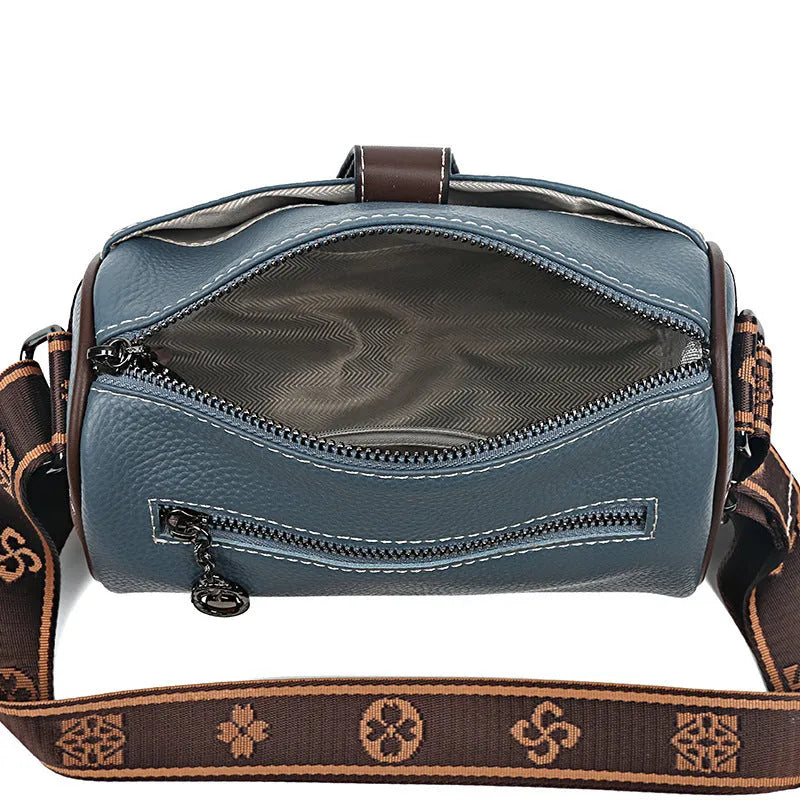 Women's top grain leather crossbody bag in blue, black, or khaki with horizontal square shape and inner pockets.