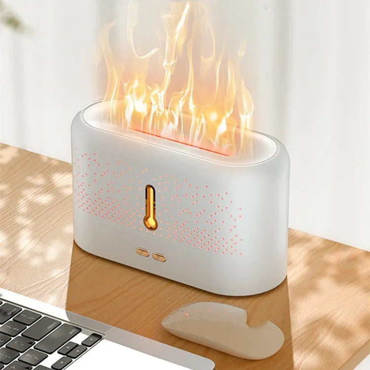 White ultrasonic aromatherapy diffuser with 200ml tank, USB cable, and essential oil bottle on a desk