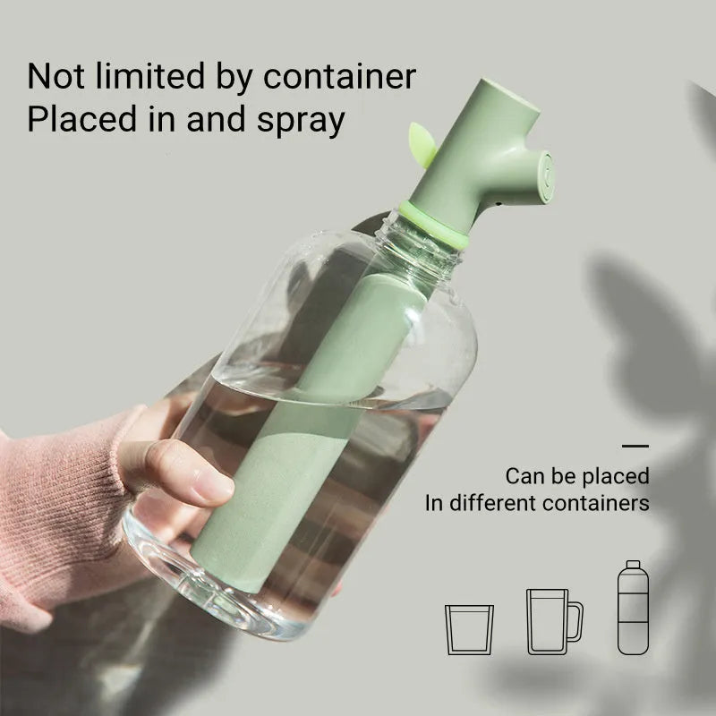 Transparent portable USB air humidifier with adjustable mist settings on a desk
