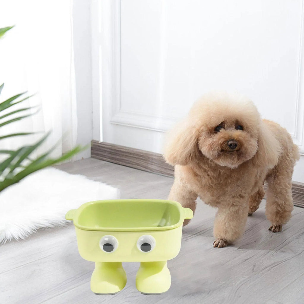 Green robot-shaped elevated cat bowl with tilted food surface and non-slip base