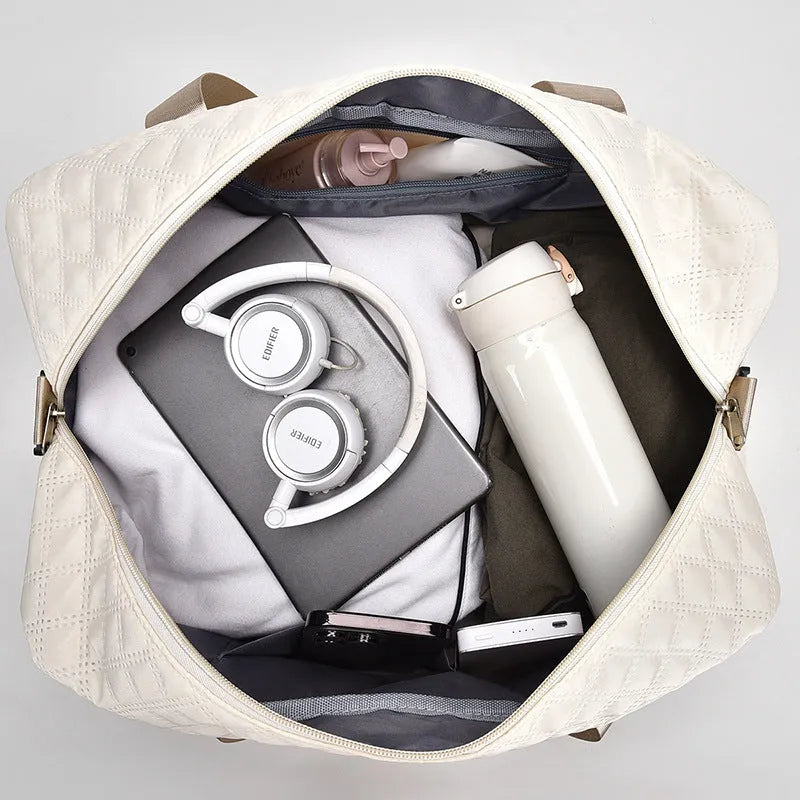 Large capacity Oxford cloth travel bag in a solid colour with visible sewing thread detail.