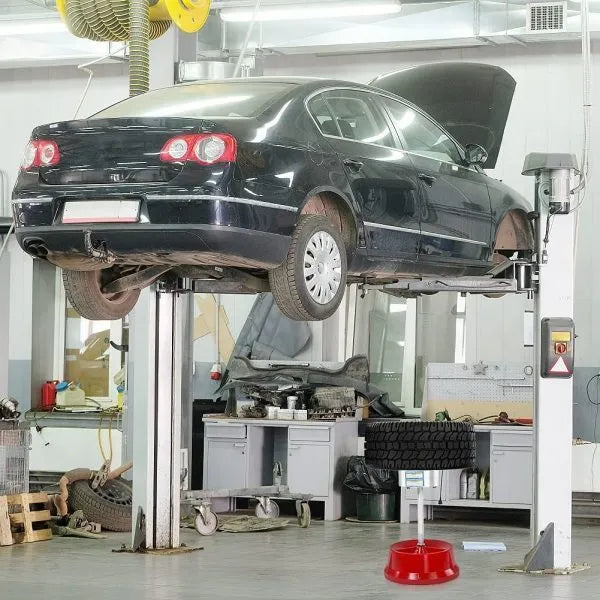Portable aluminium hub balancer for car tyres with bull's eye level on enamel base.