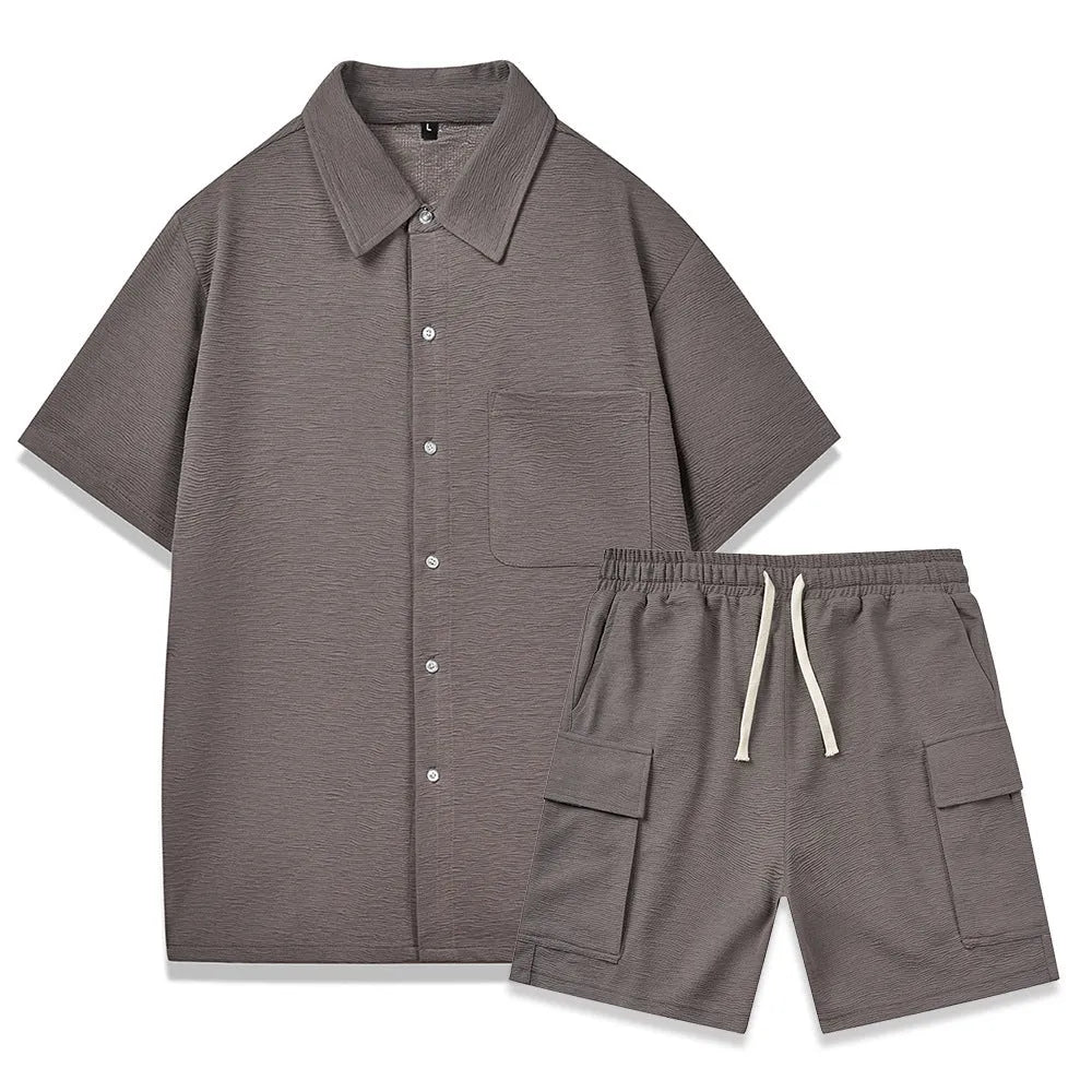 A woman's two-piece co-ord set with a short sleeve top and elastic waist shorts in a neutral colour.