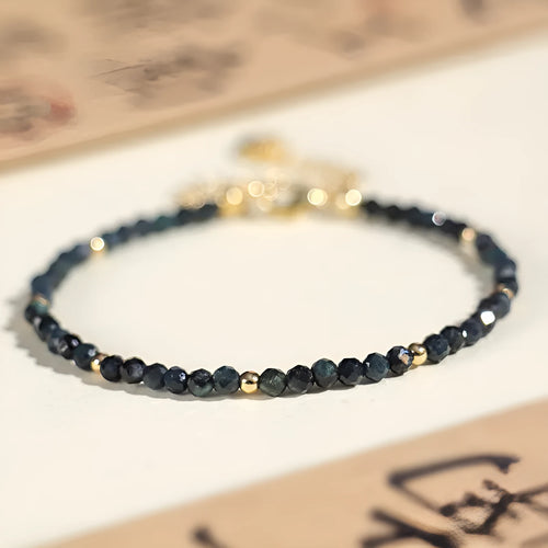 Blue tourmaline beaded bracelet with 3mm stones and spacer bead sections