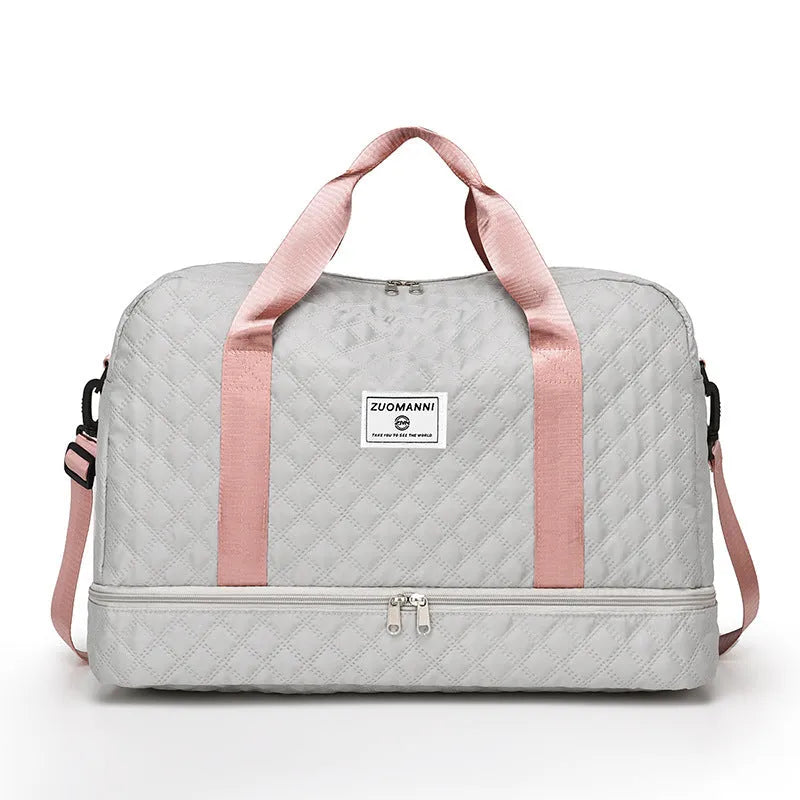 Large Oxford cloth travel bag in a solid colour showing its spacious design and street style details.
