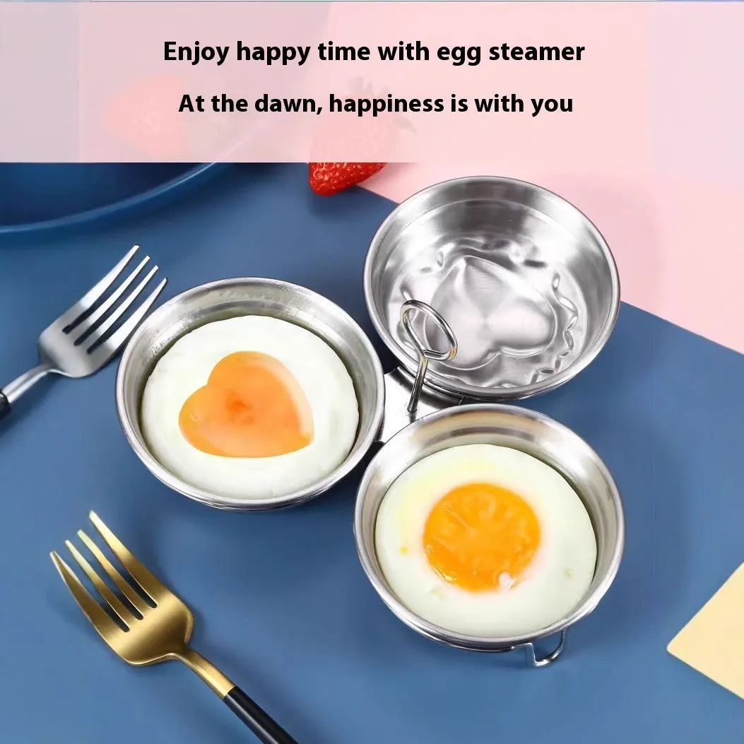 A small, round, heart-shaped stainless steel egg steamer for stovetop use.