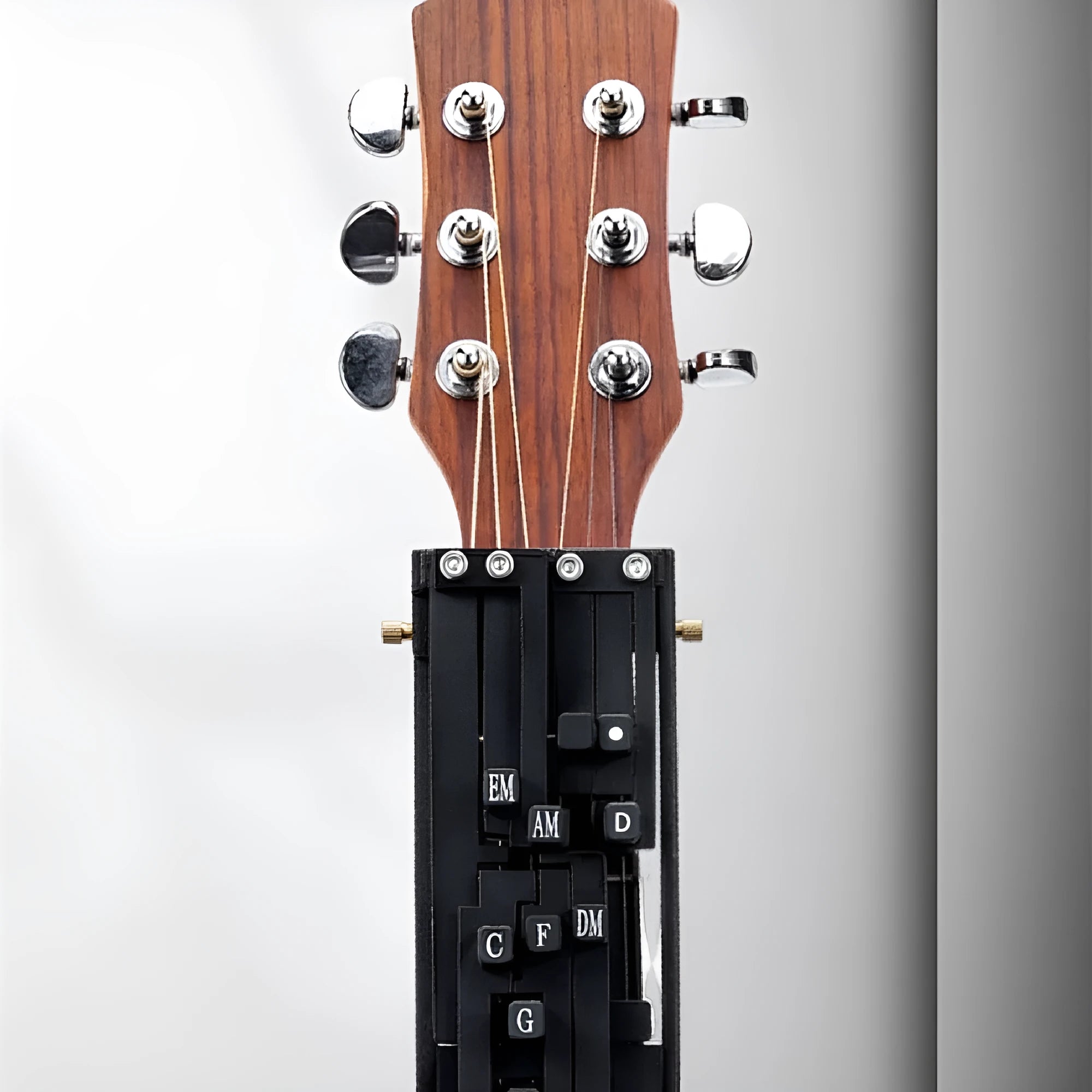 Black automatic chord changer device for folk guitar with 2024 double chord mechanism.