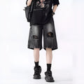 Retro washed denim shorts with loose fit and distressed ripped detailing in black or blue