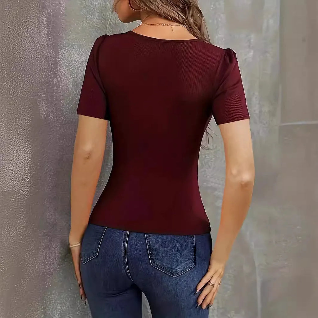 Women's wine red knitted short sleeve slim fit top on a hanger.