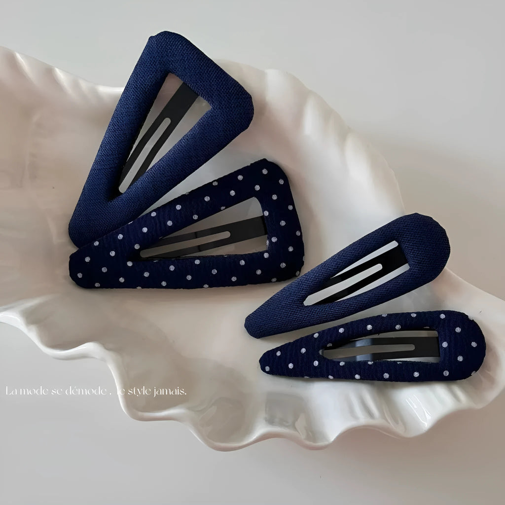Retro style hair barrettes in dark denim and polka dot patterns, showing triangle and water drop shapes.
