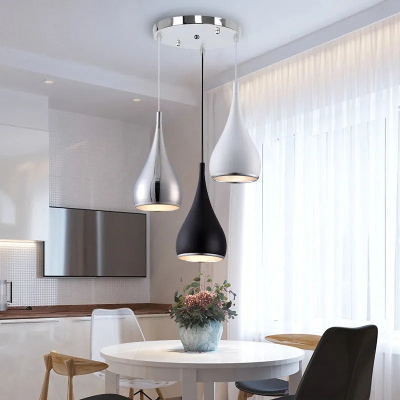 Iron minimalist chandelier lamp in black finish with three-head disc configuration for ceiling mounting