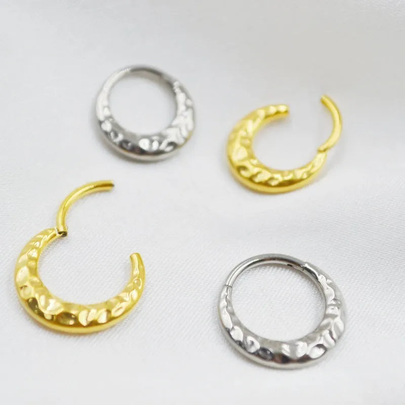Titanium alloy concave-convex nose ring in gold or silver finish with 1.2mm thickness and 8mm or 10mm diameter options