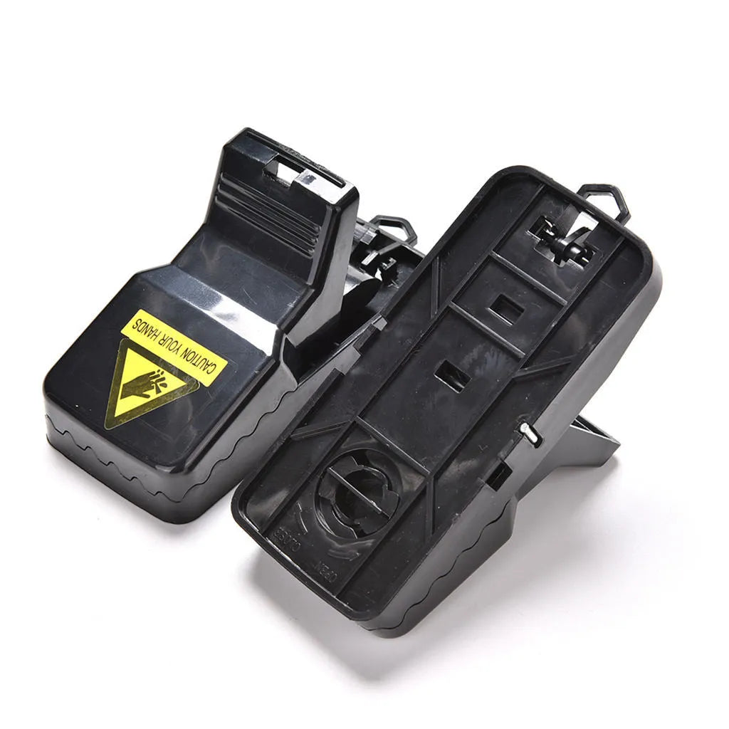 Six black plastic snapping mousetraps with metal trigger, shown on a white background.
