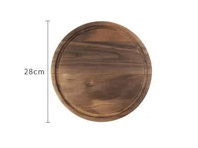 Solid black walnut wood chopping board with juice groove, available in round or rectangular sizes.