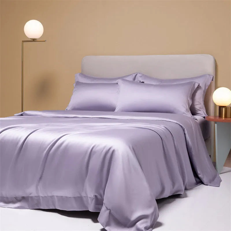 A modern, neatly made bed with a Lenzing Tencel duvet cover and pillowcases in a choice of nine colours like Sea Salt Blue.