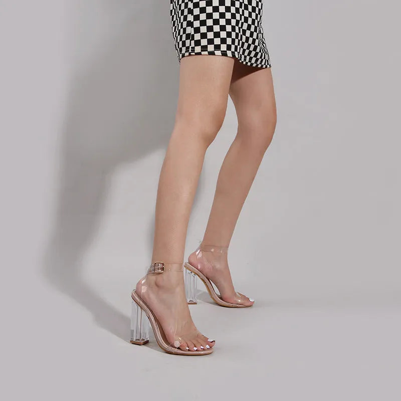 Apricot transparent PVC women's high heel sandals with glass detail and buckle closure on a melamine sole.