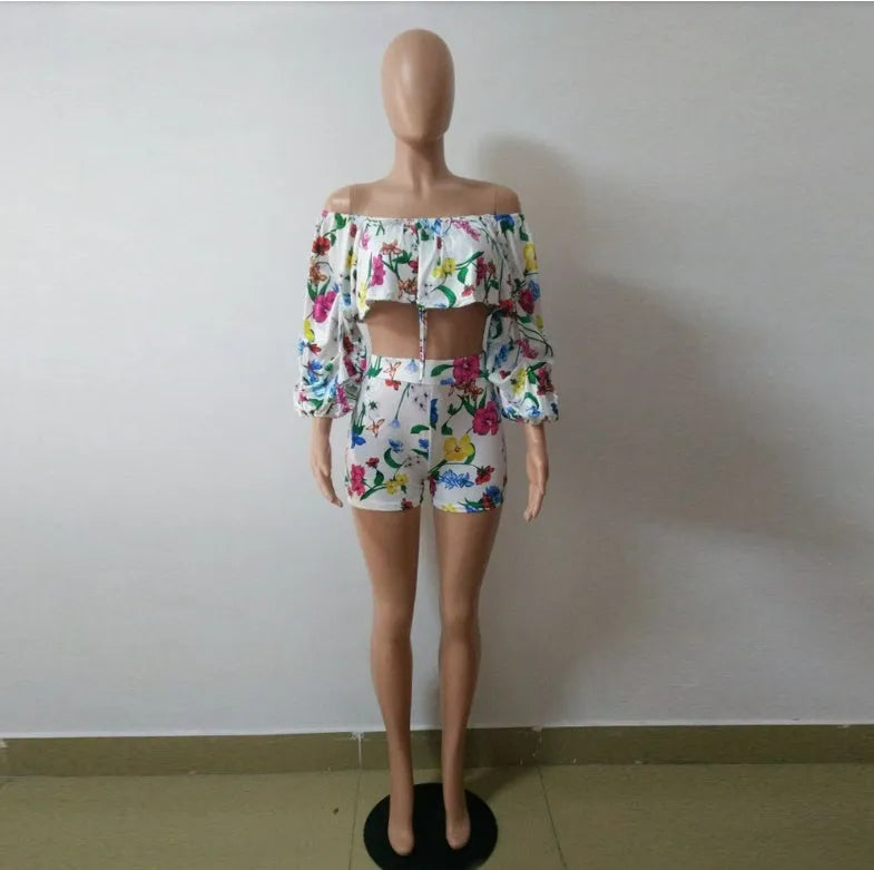 Women's multicolour digital print lounge set with puff-sleeved top and shorts.