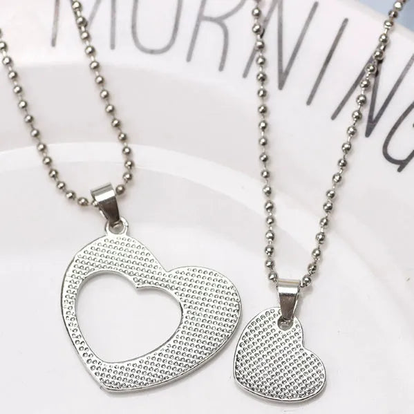 Two silver heart-shaped alloy puzzle necklaces on a cross chain, set of two, women's jewellery