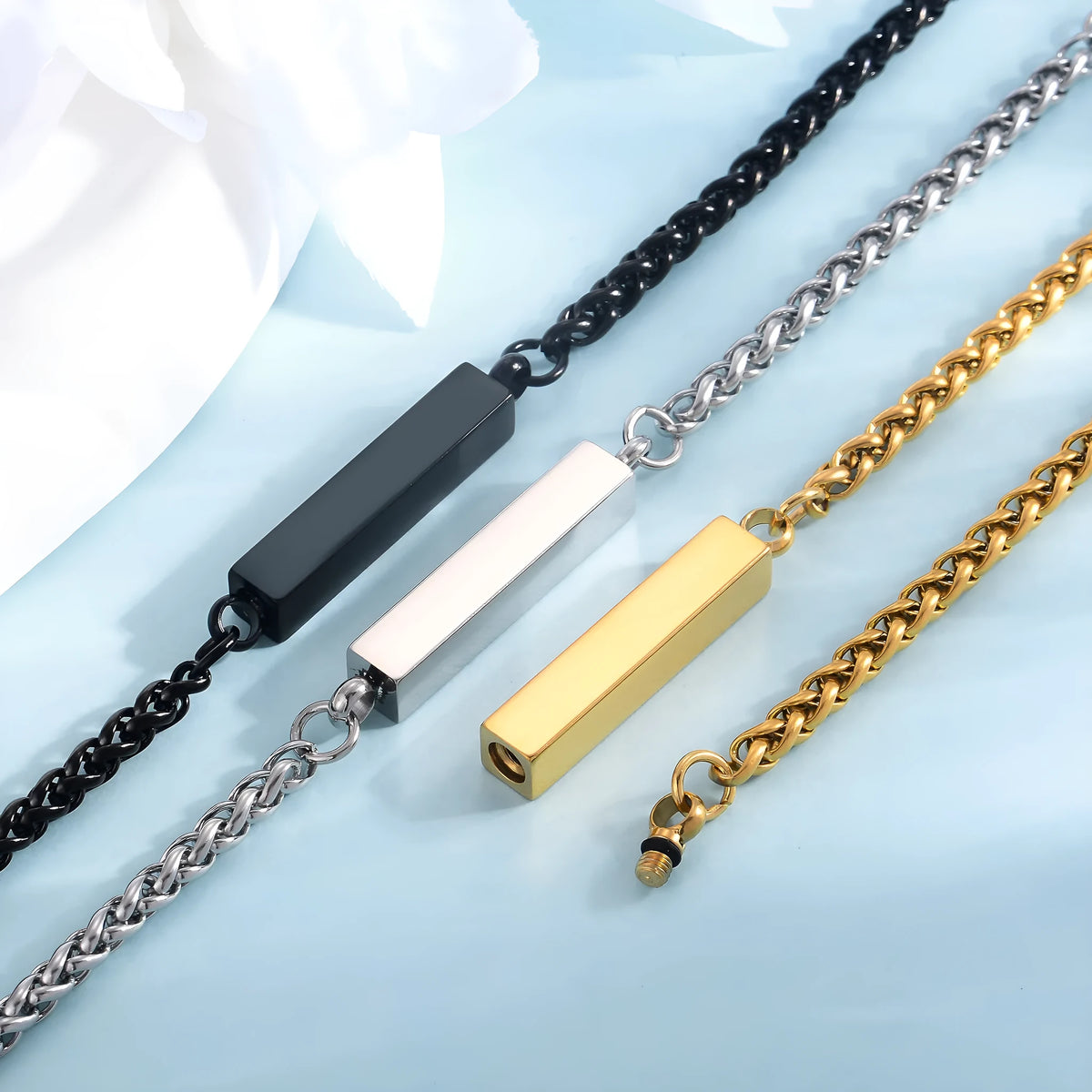 Unisex titanium steel rectangular column bracelet in silver, gold or black, 6mm x 30mm centre with 18cm band and 5cm tail chain.