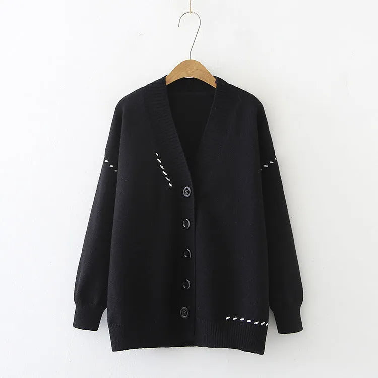 Women's loose fit knitted cardigan coat in black or white, long sleeve design