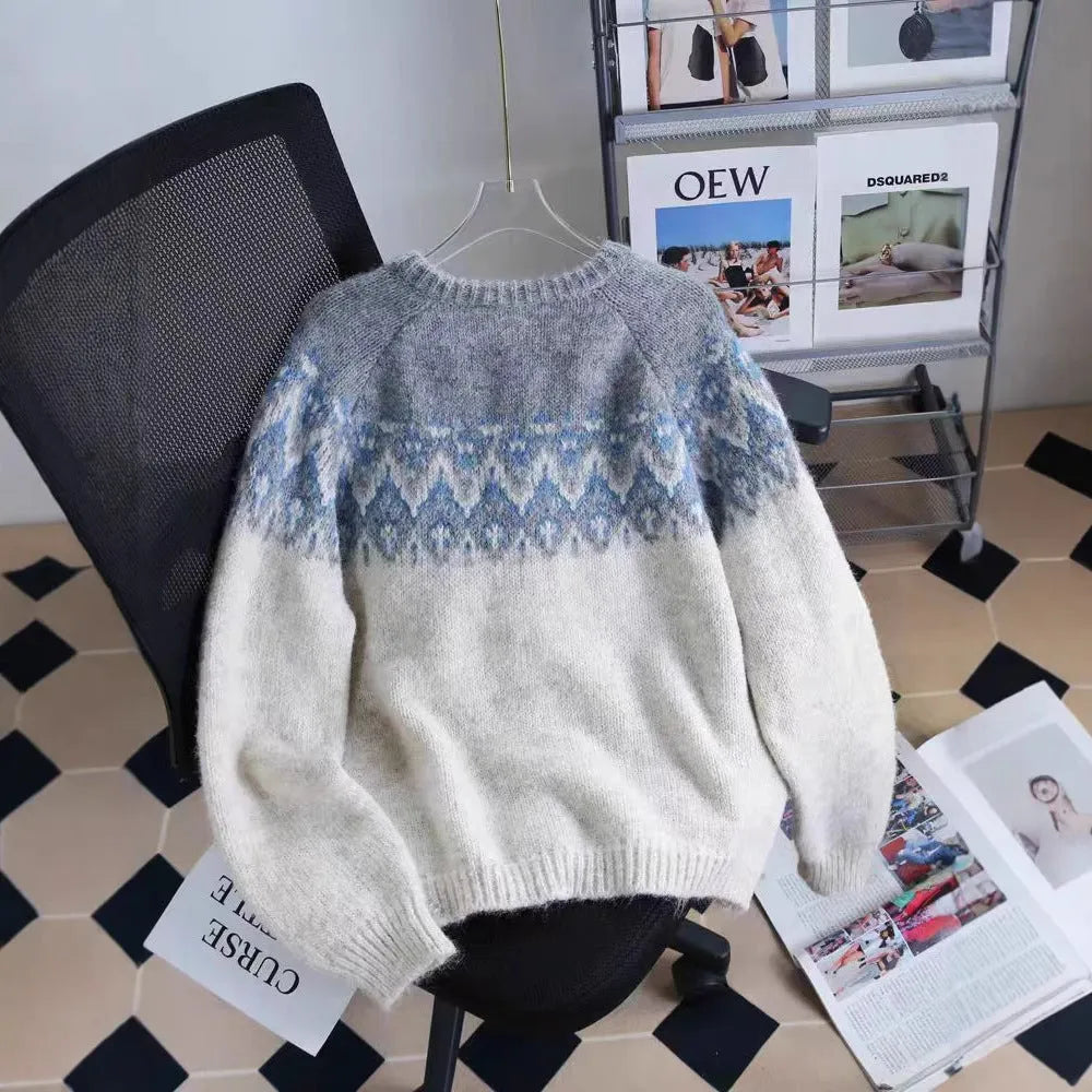 Women's beige jacquard knit sweater coat with loose fit and long sleeves.