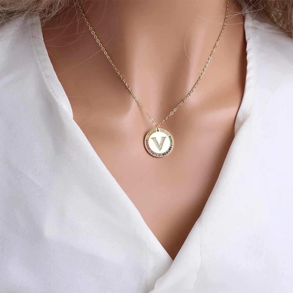 Gold English letter round pendant necklace with colourful crystals on clavicle length chain
