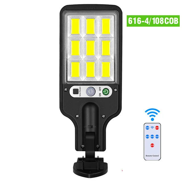 Outdoor solar LED wall lamp 28LED variant mounted on a garden fence for patio lighting