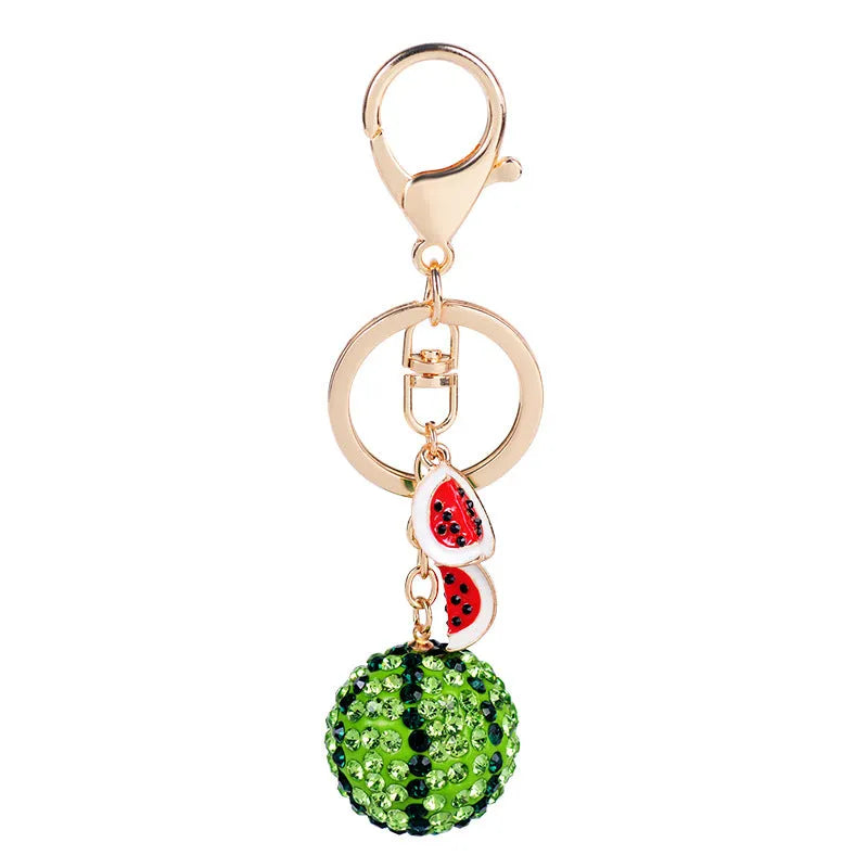 Green zinc alloy watermelon-shaped keychain on a white background.