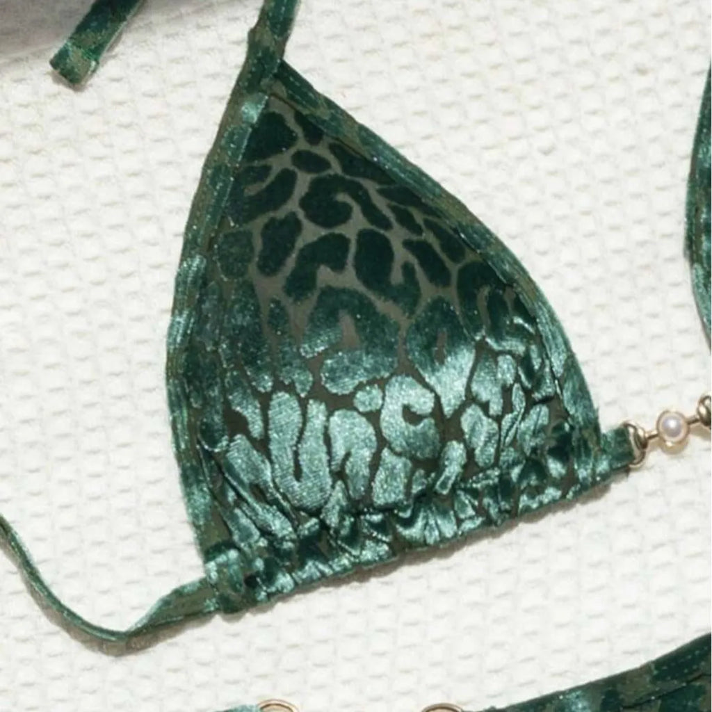 Women's blue leopard print T-shaped swimwear bikini set made from polyester and spandex fabric.