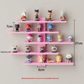 White 5-tier PVC wall-mounted rack displaying toy dolls and blind boxes.