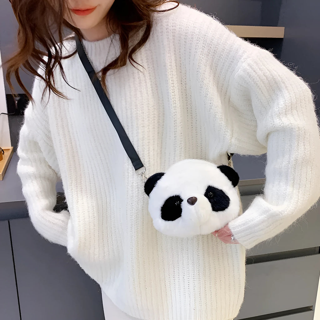 Soft cylindrical plush crossbody bag with panda head design, showing front sandwich pocket.