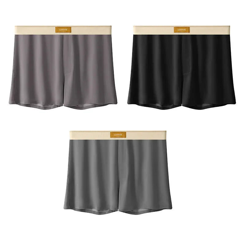 Pack of men's solid colour ice silk boxer shorts showing loose fit and mid-waist design.