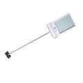 Black and white waterproof solar-powered LED garden light for outdoor use.