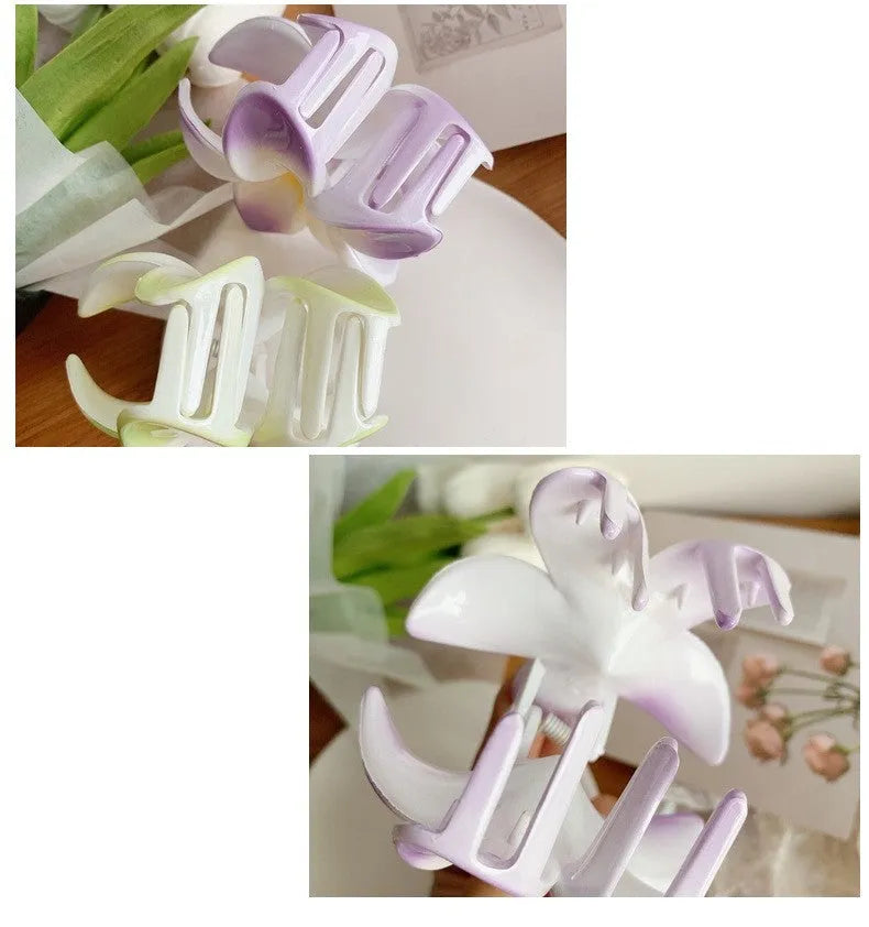 Muweordy plumeria hair claw clip in blue, a decorative flower hair accessory made from plastic and resin.