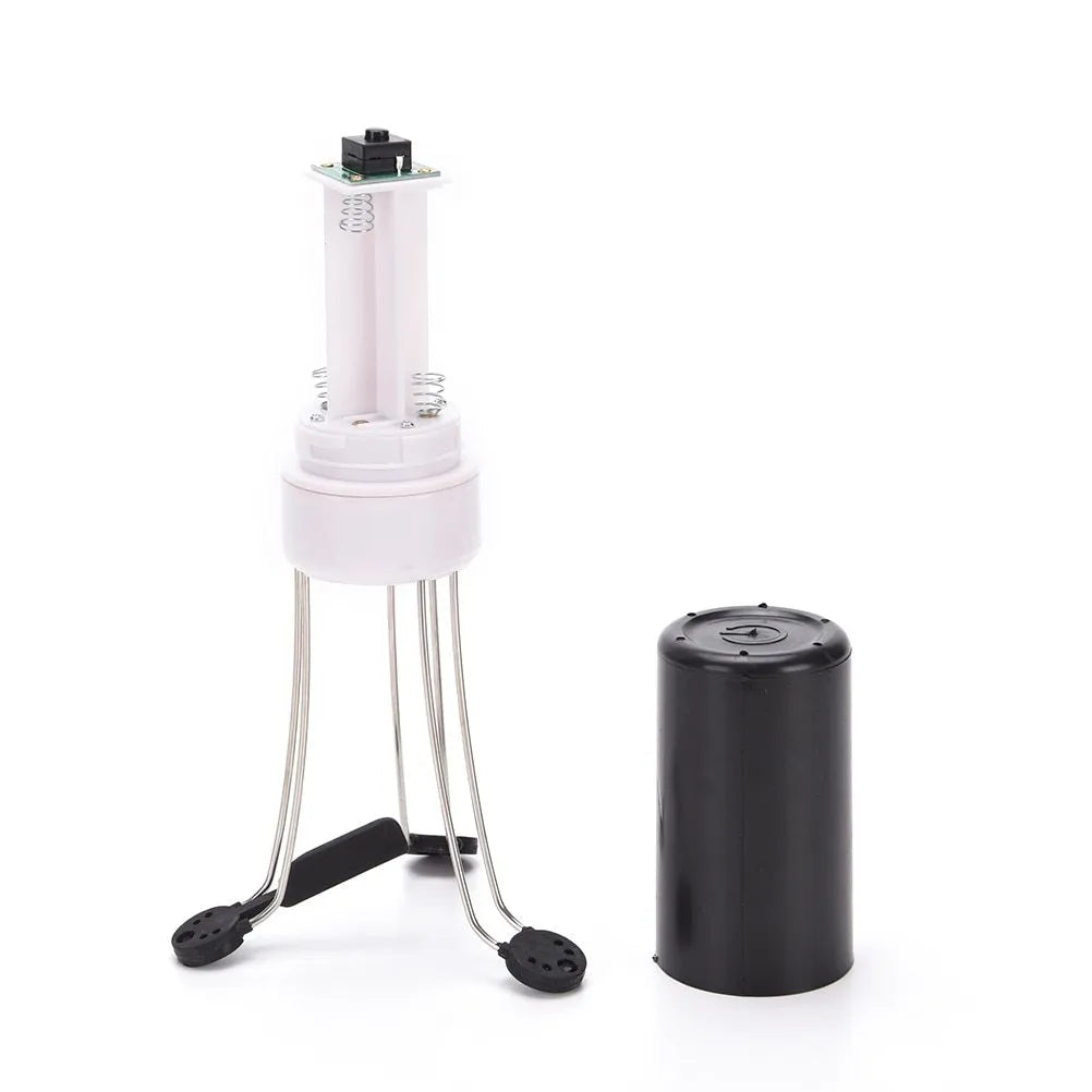 White and black wireless automatic blender with stainless steel stirring arms on kitchen counter