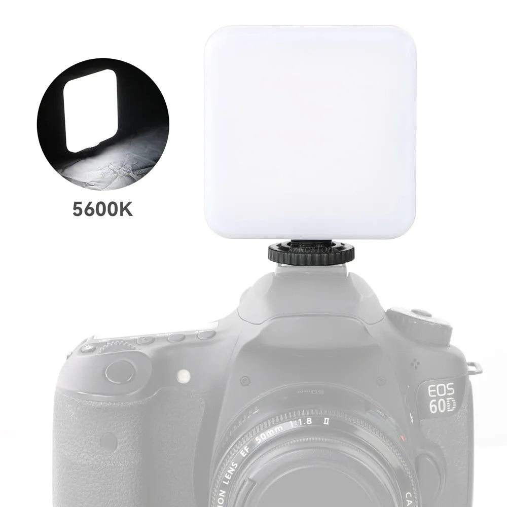 Compact black LED mini square camera flash with rotatable head on a small tripod stand