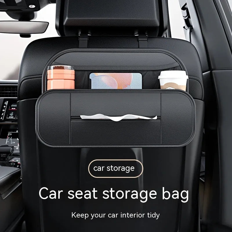 Black leather car seat rear storage bag with compartments, shown mounted on a car seat.