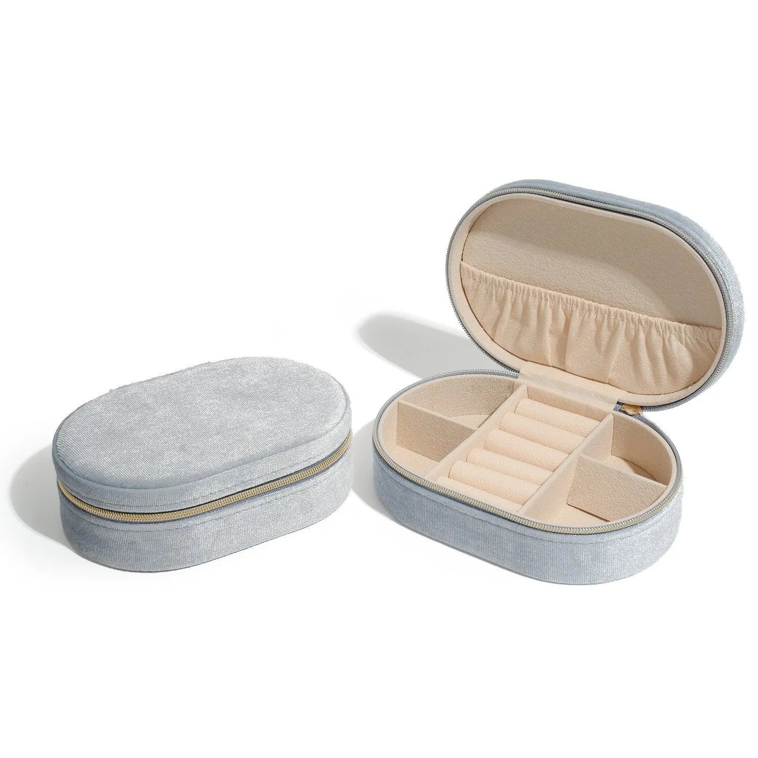 Oval velvet jewellery storage box in lake blue with flannel interior, measuring 15 by 10 cm.
