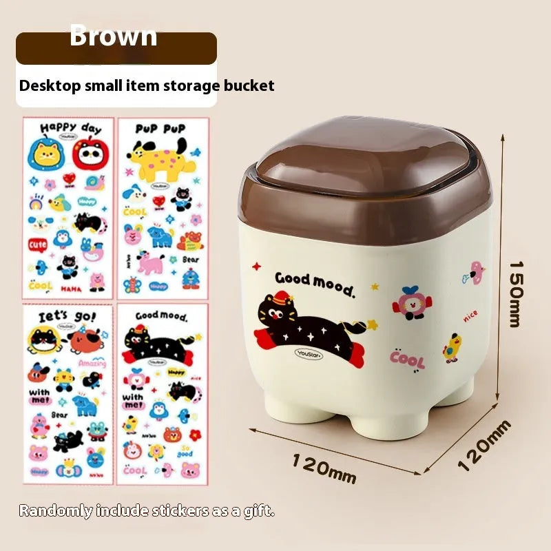 Cartoon-style plastic desktop organiser with grid compartments and red or brown stickers.