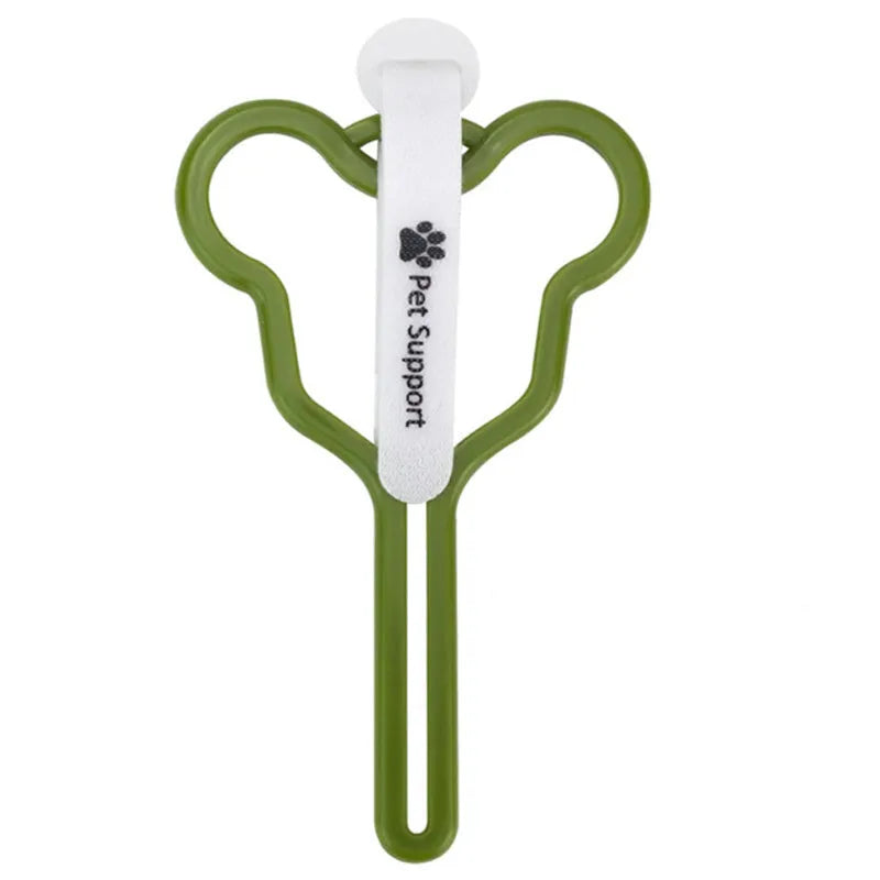 A hands-free dog poop bag holder with a hook and loop fastener strap, shown attached to a dog leash.