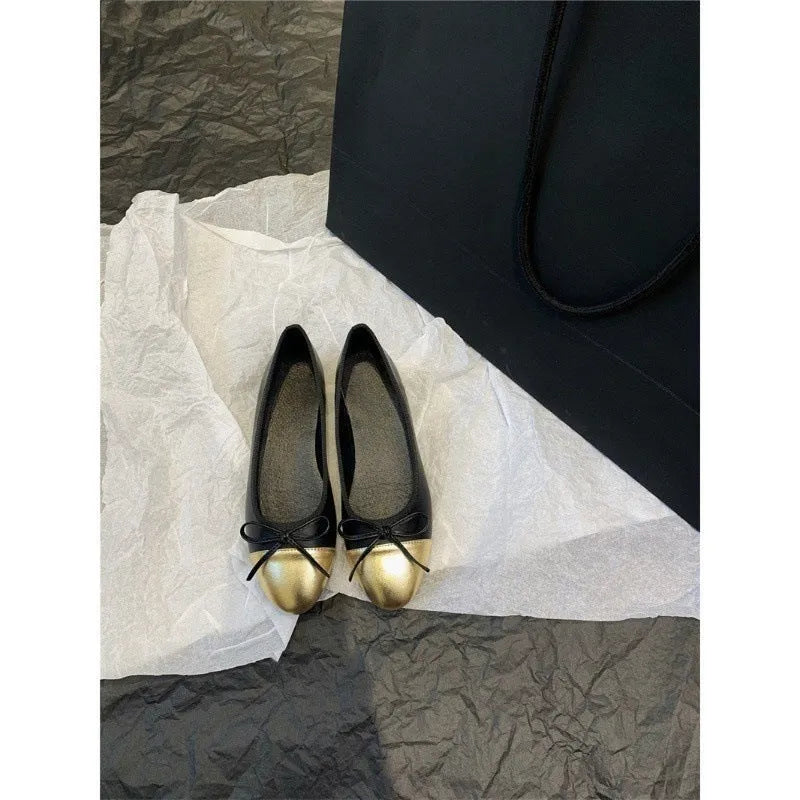 Women's apricot colour ballet flat pumps with a round toe and flat rubber sole.
