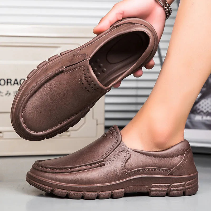 Men's black waterproof slip-on work shoes with platform sole and leather lining