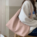 PU leather casual armpit bag for women, high capacity tote in black solid colour