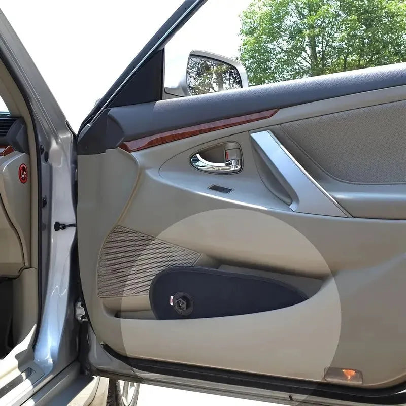 Black breathable mesh car side window sunshade stretched over glass with visible suction cups.