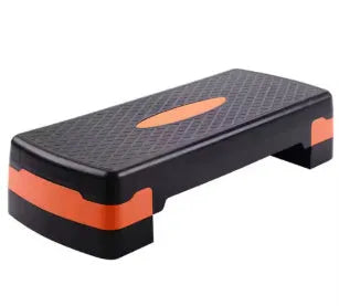 Grey Fit Step aerobic exercise platform on a home floor.