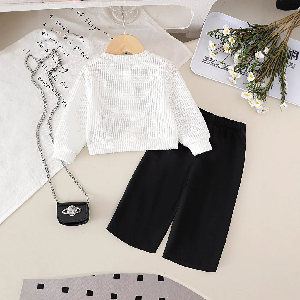 Baby girl cotton outfit set with white long-sleeved wool flower top and black trousers for toddlers 6 months to 3 years