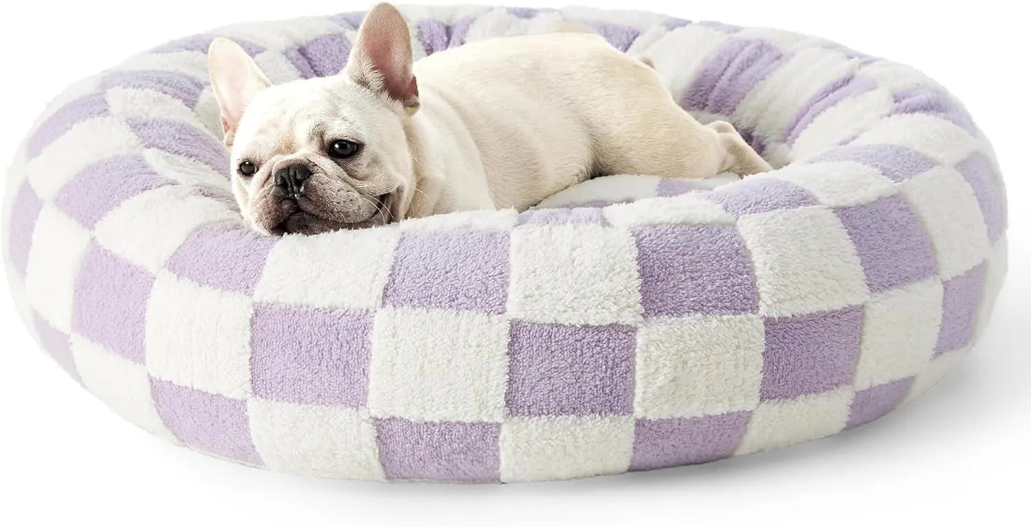 Round plastic dog bed in blue and white plaid pattern showing removable cover option