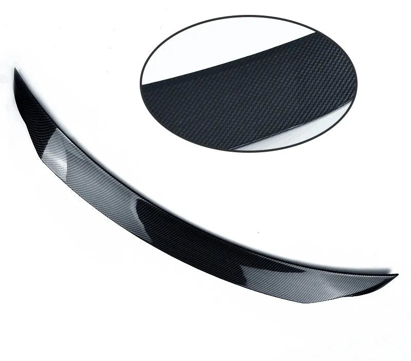 Large bright black fixed rear spoiler wing for Mazda 3 Axela Exela on car boot.