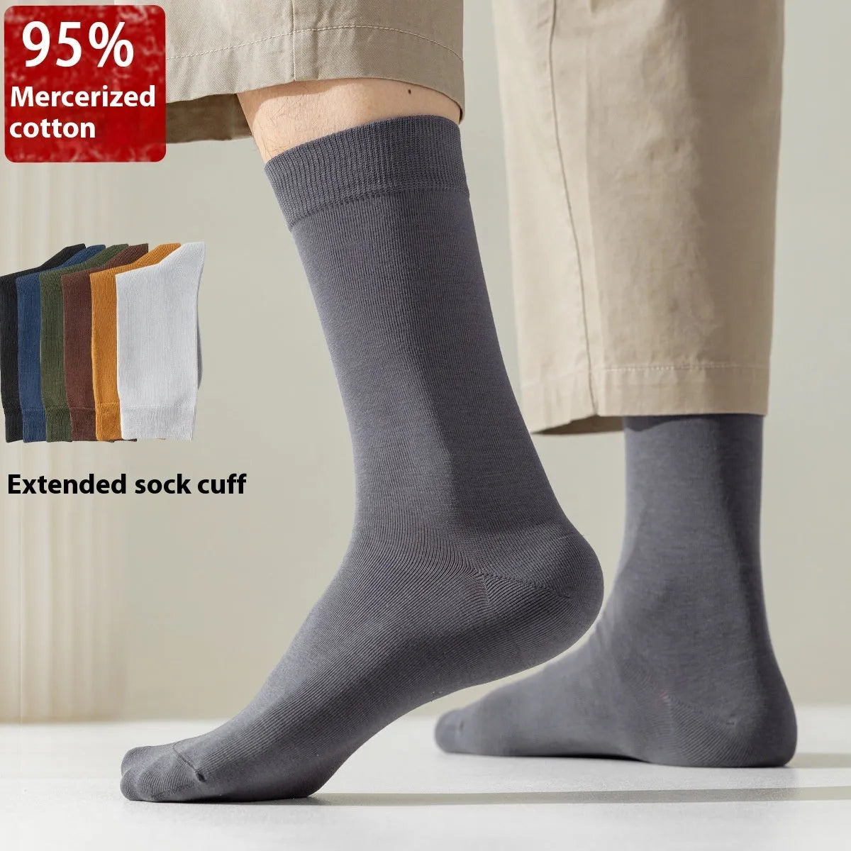Five pairs of men's solid colour mid-calf socks made from combed cotton, shown in assorted colours.